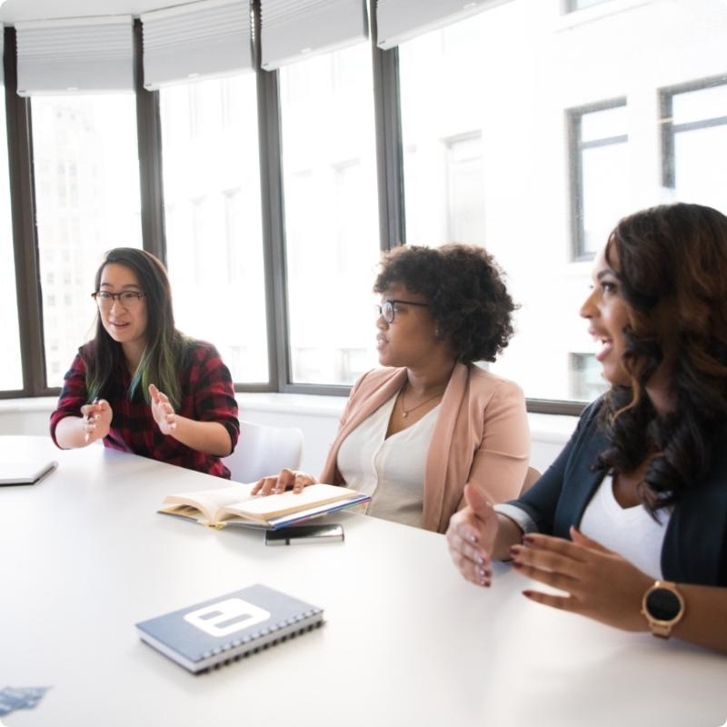 Group of three women in a meeting