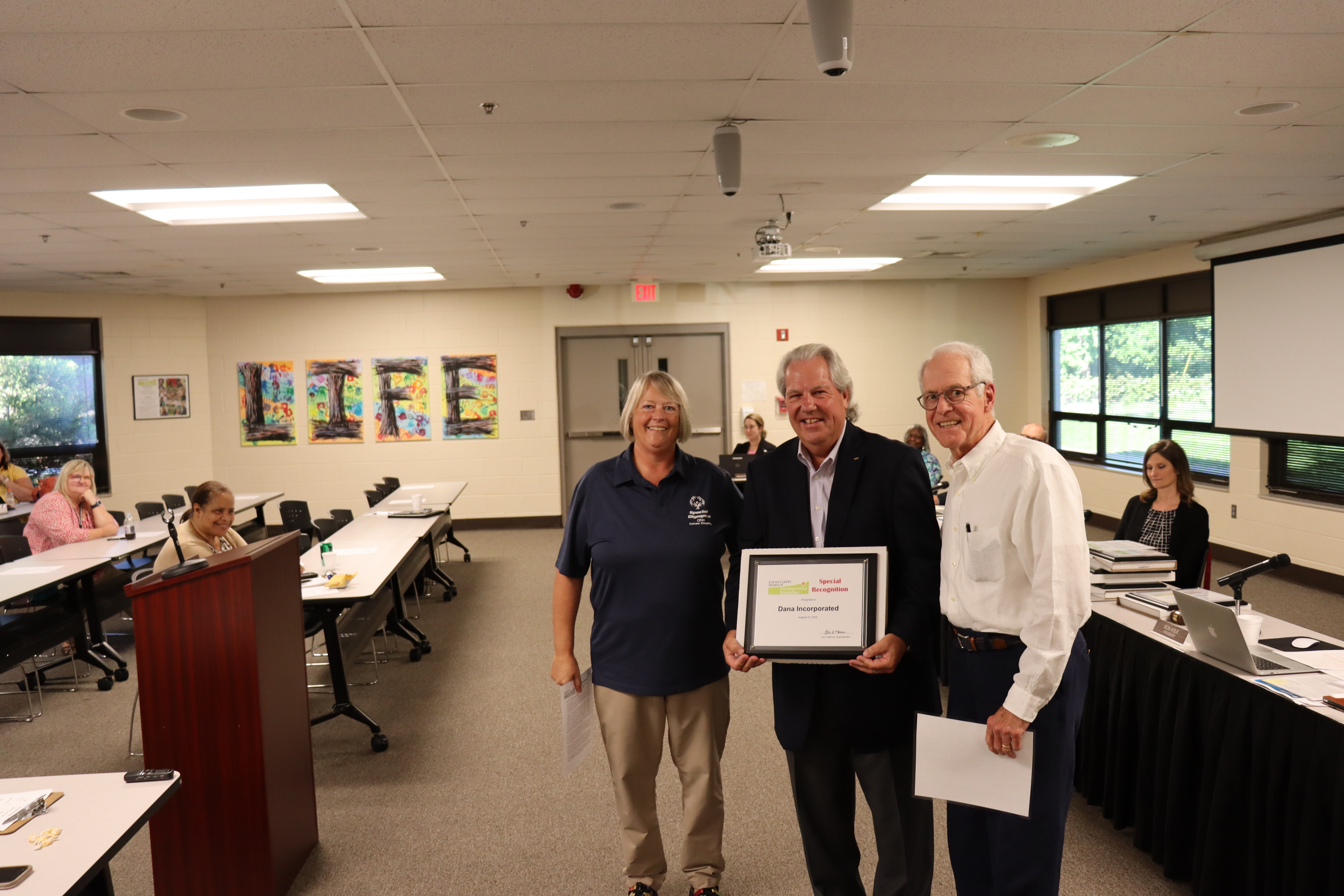 Rod Filcek, retired Dana employee, and tournament chair of the AJGA Dana, Inc. Junior Open with Board President Ron Volk and Sherrie Hathaway, Community Inclusion Coordinator.