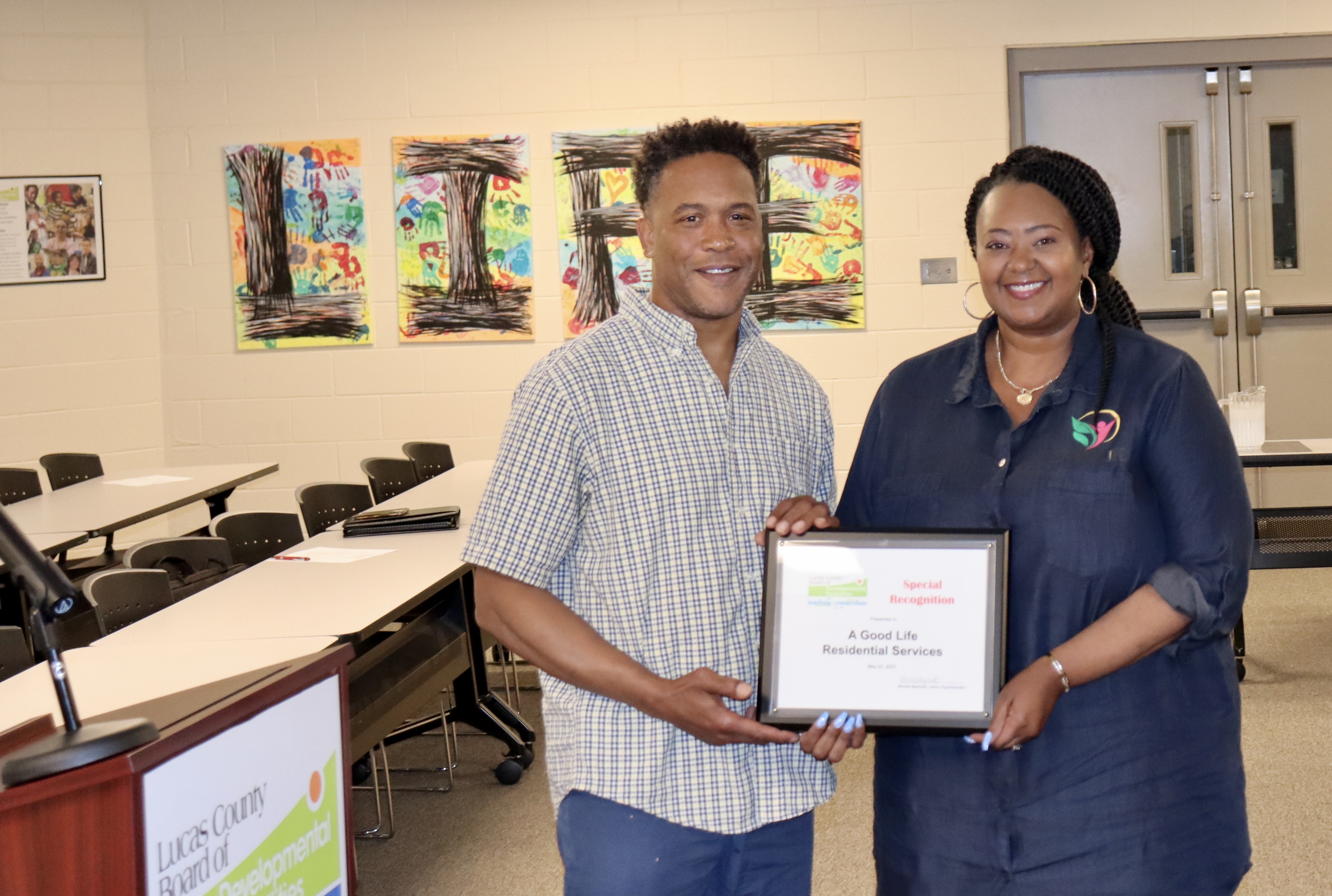 Curtis Cotton, left, and A Good Life CEO Roshonda Woodley receive the Special Recognition Award