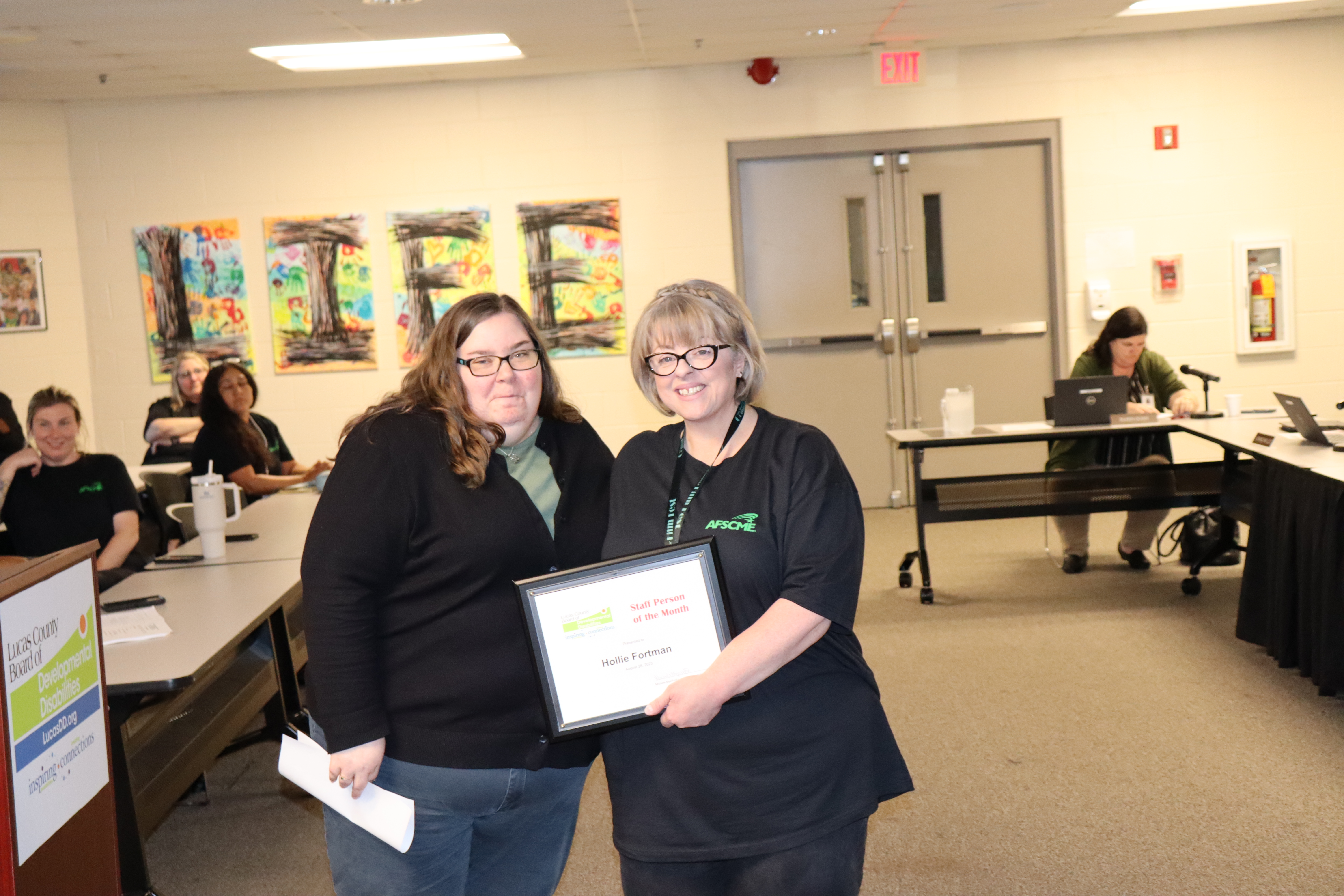 Photographed in front of podium are Lucas DD SSA Hollie Fortman, right, with SSA Coordinator Jaclyn Brown.