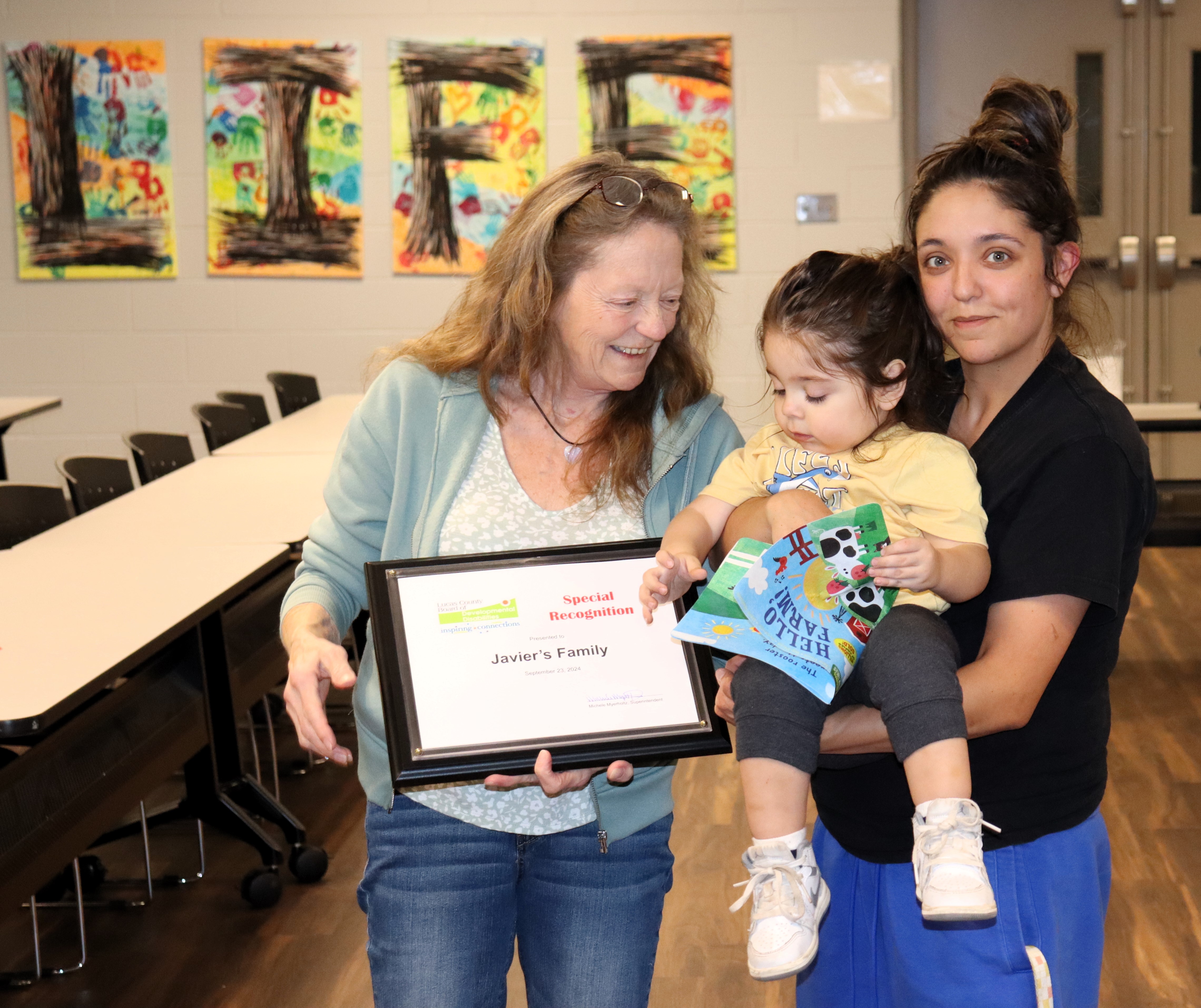 Javier's Family receiving their award