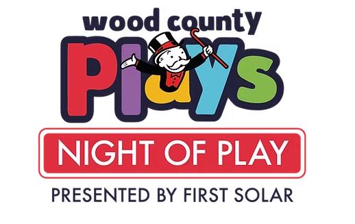 wood county plays with Monopoly character coming out of the "A"