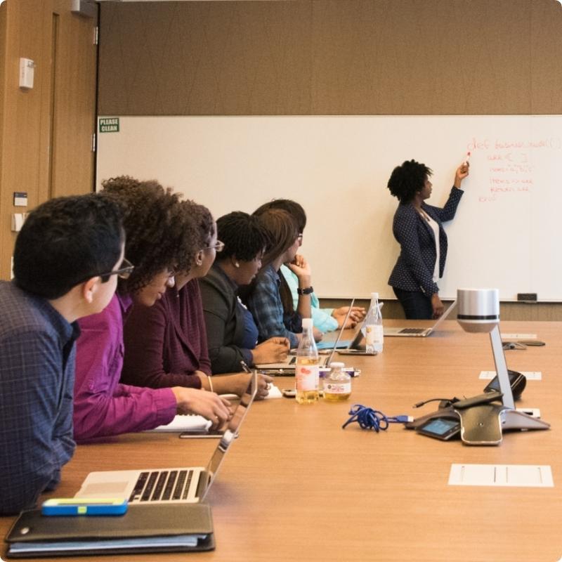 Group of People at a Whiteboard