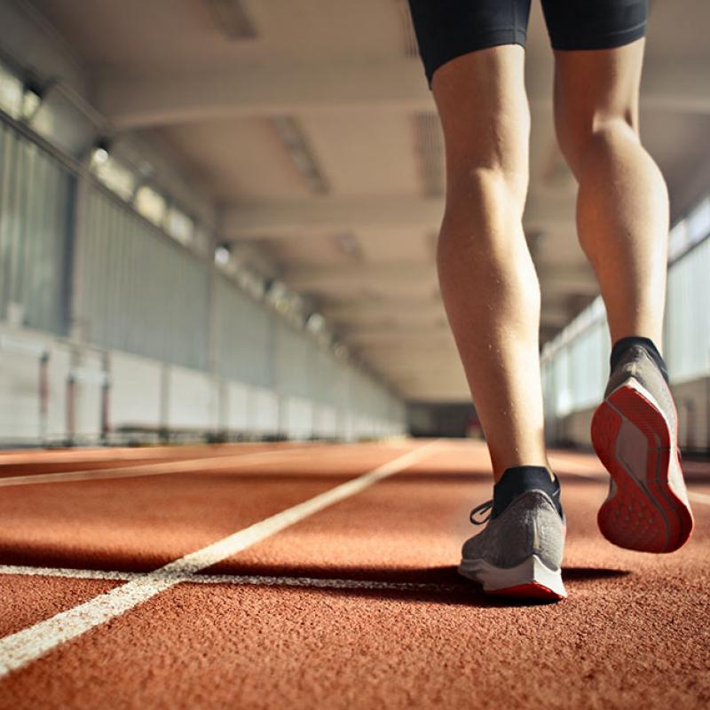 Legs Running on a Track