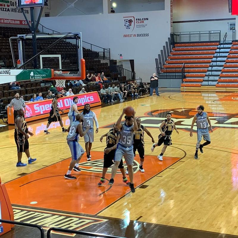 A Team Playing Basketball