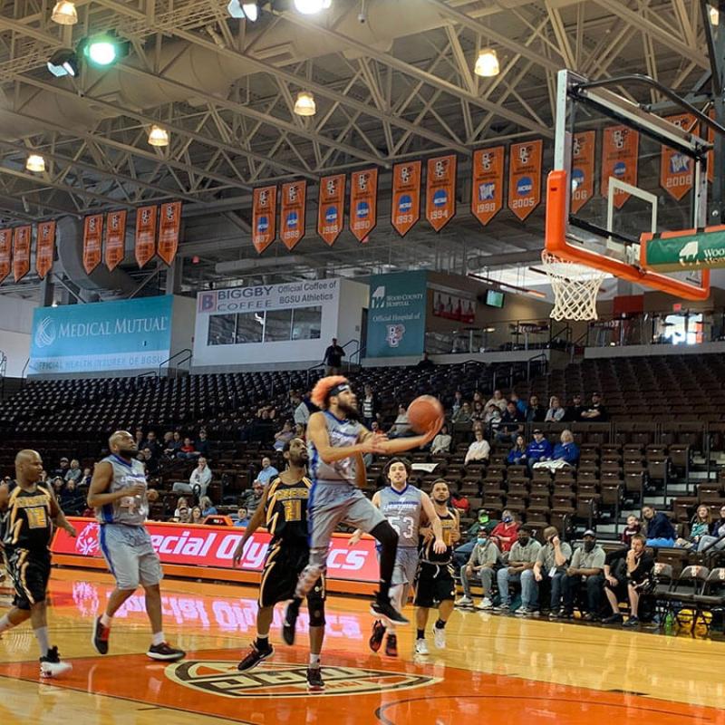 A Team Playing Basketball