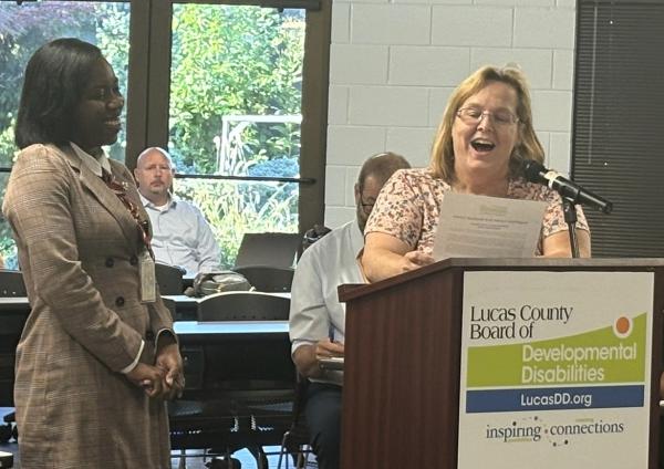 Tanya Goff-Davis presenting Staff Person of the Month award to Quidrela Lewis