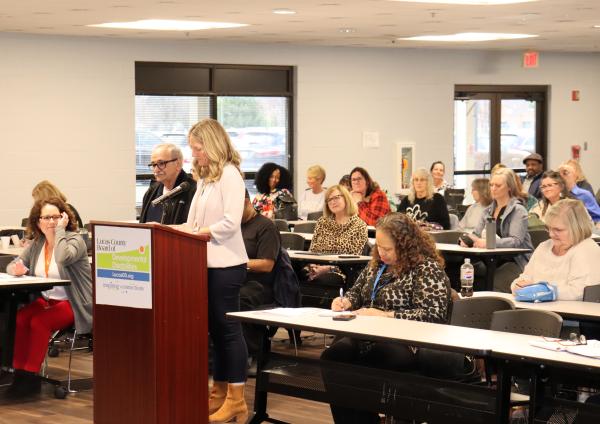 Assistant Superintendent Amy Priest recognizing the retirement of Nic Bruno