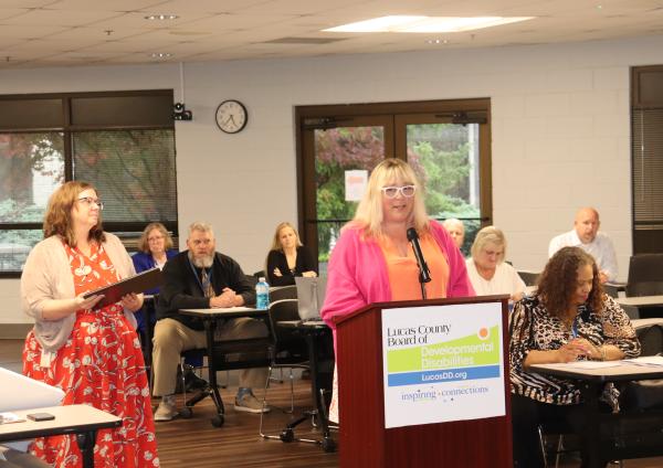 Assured Health's Jill Harrington at the podium accepting her award.