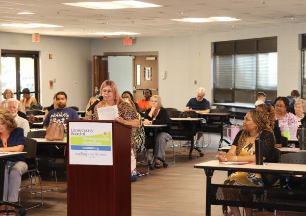 Phillis Schmidbauer reads her speech upon graduating from the Leadership Academy
