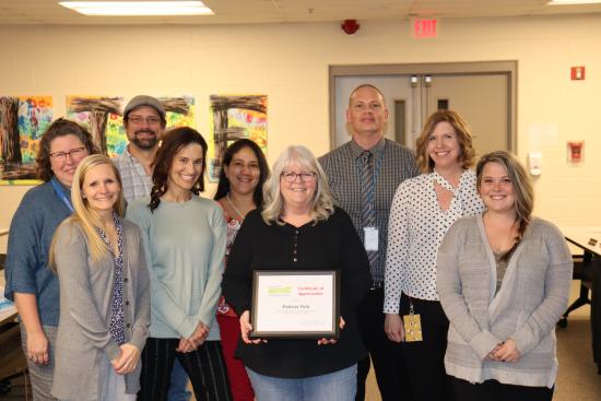 Pat York, center, had all former colleagues in attendance join her for the picture!