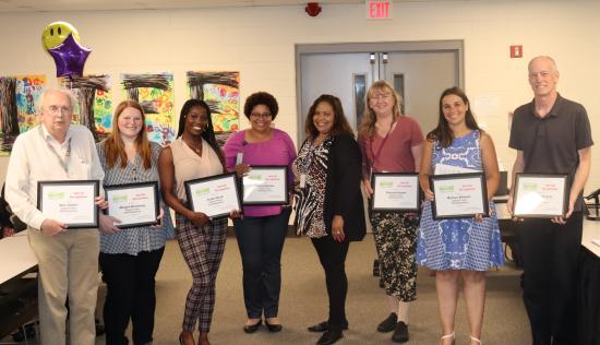 Photo of SSA Support Staff holding awards